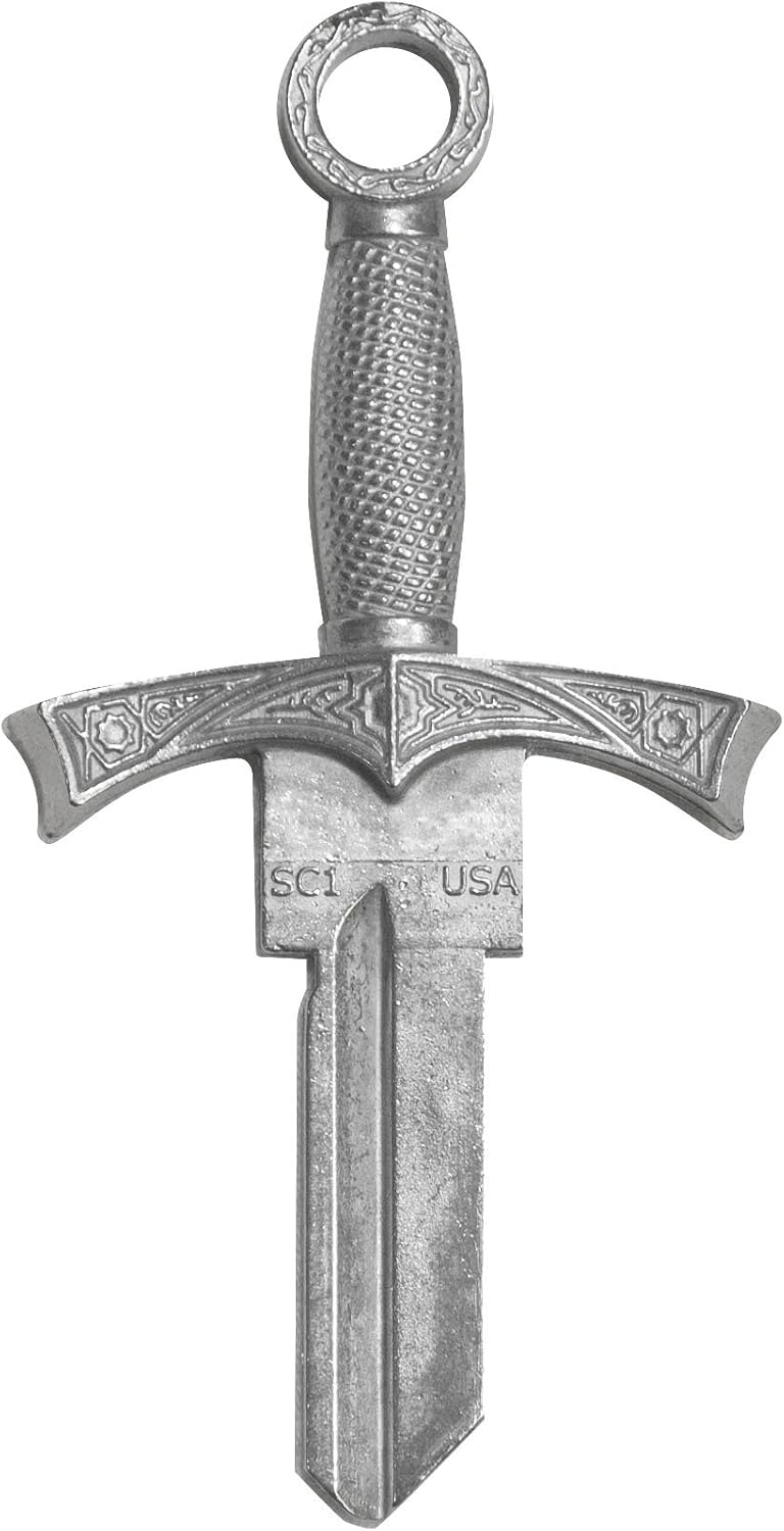 A decorative metal key blank featuring an ornate sword design with an elaborate crossguard, textured grip, and looped pommel, marked "SCI USA" on the blade.
