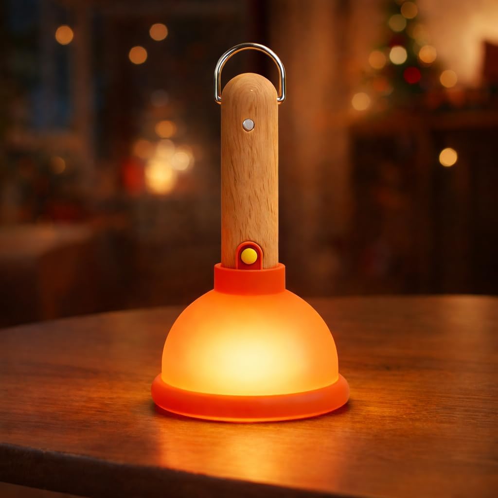 for Plunger Nightlight

A whimsical LED nightlight designed to resemble a toilet plunger, featuring a glowing orange dome base with a red silicone band, a wooden handle with a metal hook, and a small red detail near the top. The warm amber light creates a cozy glow on a wooden surface against a blurred festive background.