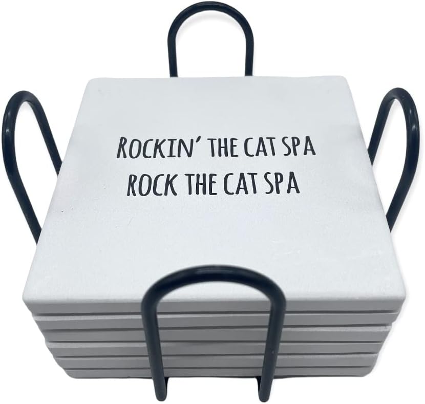 White ceramic coaster set featuring black handles and the humorous misheard lyrics "Rockin' the Cat Spa / Rock the Cat Spa" printed on the top surface.